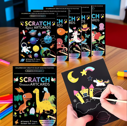 Scratch artcards with colorful designs on a wooden surface
